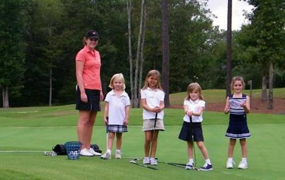 (photo courtesy of MercerBears.com) Marrin, shown her at the Just Us Girls golf camp, had a stellar season in her sophomore year, finishing in a tie for 25th at the A-Sun tournament.