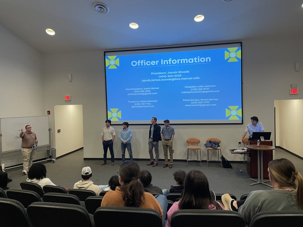 Members of the ATO Executive Board, including ATO President Jacob Woods '25, stand to answer further questions alongside Assistant Director of Campus Life Adam Penland after informing their peers about the 2022 theft. 