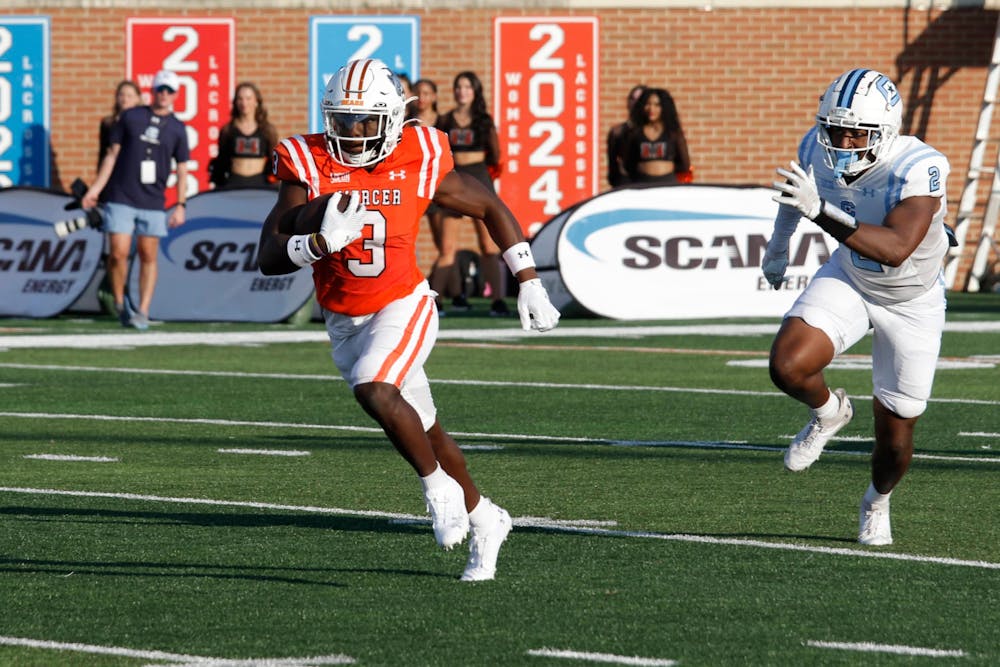 Dwayne McGee '25 rushes against The Citadel on Sept. 21. McGee is the team's leading rusher through five games as he averages 77.8 yards on the ground per contest.