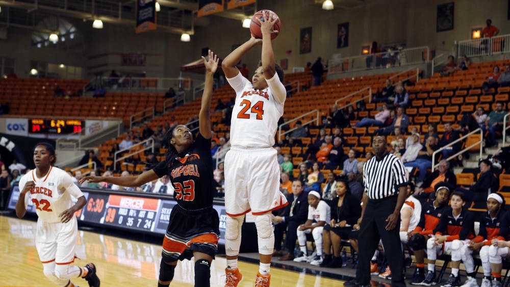 Kahlia Lawrence shooting a jumpsuit against Campbell. 