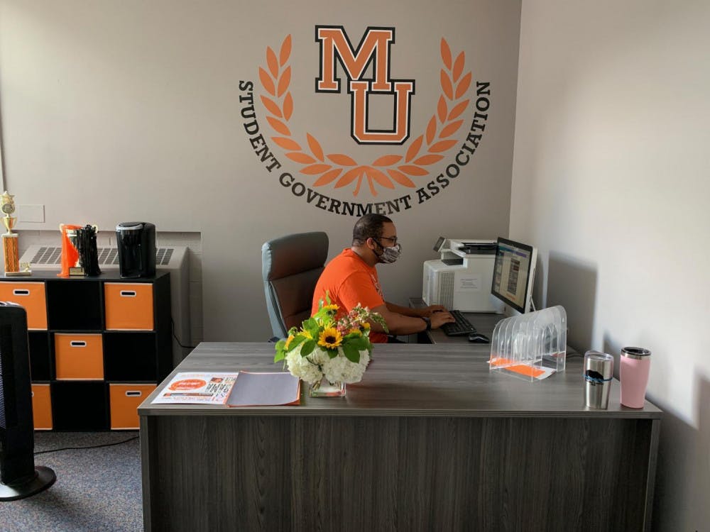 Rylan Allen, Mercer’s 2021-2022 SGA president, works in the newly remodeled SGA office in the Connell Student Center.