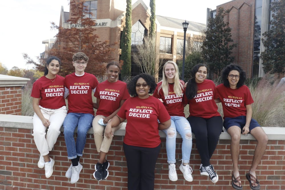 <li>(Left to right) Parneeta Mohapatra, Alec Campbell, Addison Young, Katie Johnson, Mahi Patel and Shaan Prasad pose with Dr. Chinekwu Obidoa (center). These students and Obidoa served as members of the Mercer Students Mark HIV @ 40 committee to raise awareness of HIV 40 years after the first reported cases of the disease in the U.S.</li>