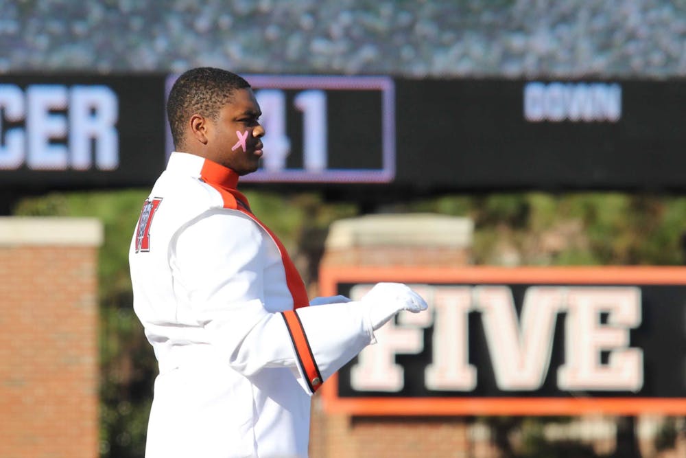 <p>Michael Bloom &#x27;25 leads the Mercer marching band&#x27;s halftime performance on Oct. 25, 2025.</p>