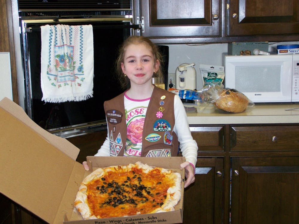 In Elementary School, Rylee's troop learned how to make pizzas at a local restaurant. 