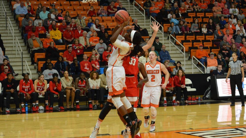 Alex Williams taking a jump shot. 