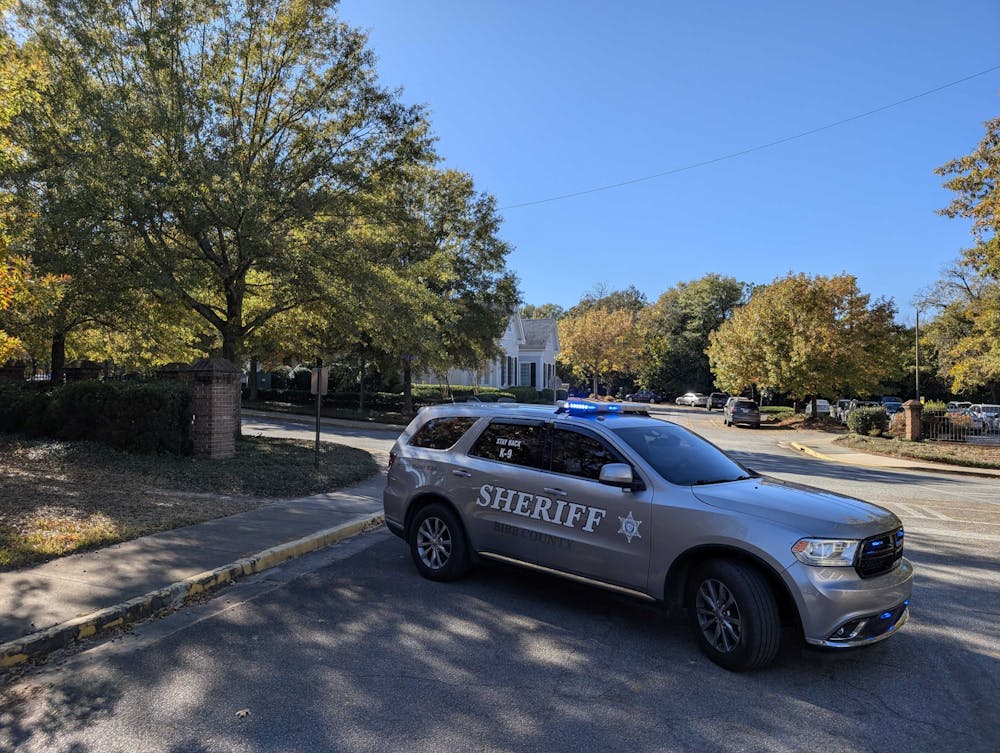 <p>A Bibb County Sheriff&#x27;s vehicle parked in front of the Admissions Office.</p>