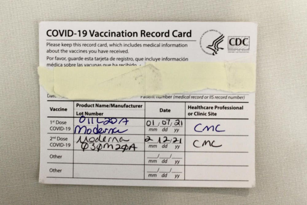 <p>A CDC COVID-19 vaccination record card.</p>