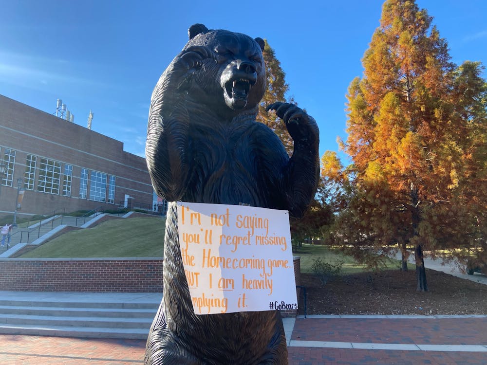 One of many signs that hung from the Mercer Bear statue in front of the University Center on the week of home football games.