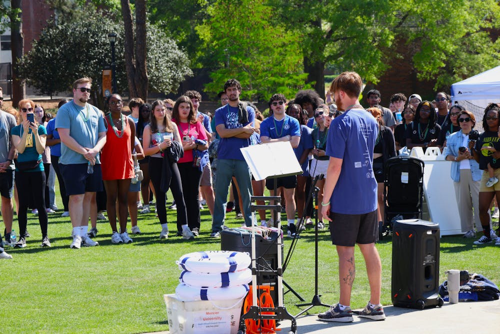 Will Spurlock ‘26 speaks to a crowd on Cruz Plaza during the Out of the Darkness Campus Walk Saturday, April 11, 2026. The Mercer community helped raise more than $13,000 for the American Foundation of Suicide Prevention, a record-high for the event.