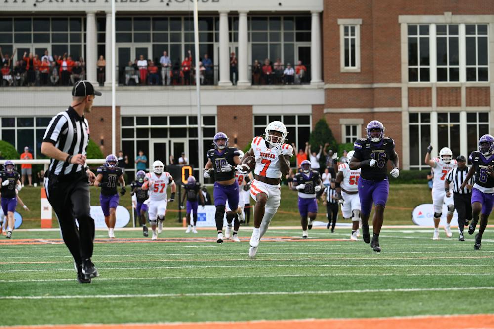 Fifth-year running back Zahmari Palode-Gary sprints past Western Carolina University defenders for a 63-yard touchdown catch on Saturday, Oct. 10.