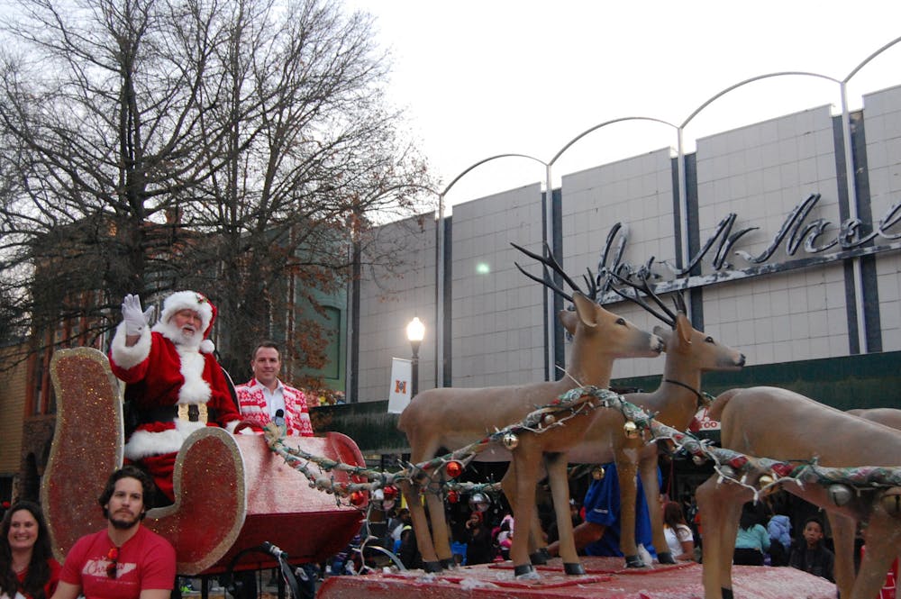 Santa Claus waves from atop his sleigh in the finale of the 2021 "Macon Merry" parade.