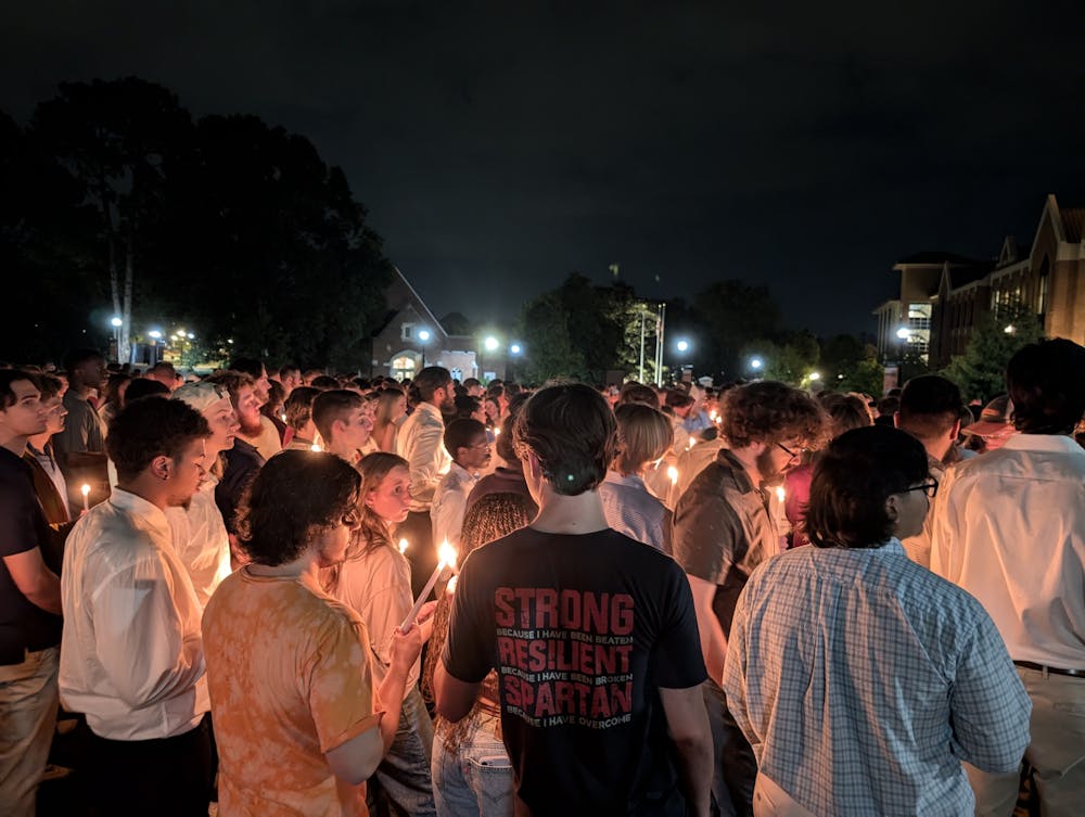 Students gathered on Cruz Plaza Sunday night for a candlelight vigil to remember Mason Sells.