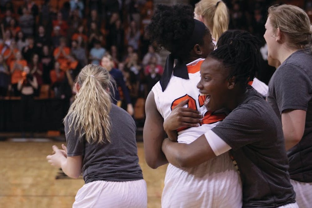 The Bears celebrate after their 67-44 victory over the Mocs.