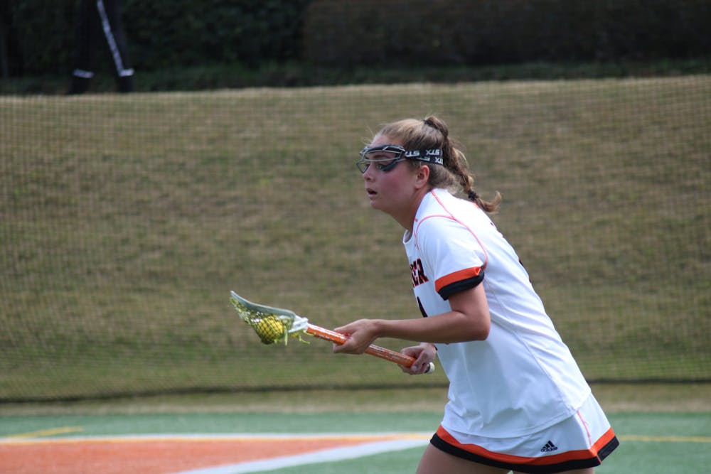 Mercer women's lacrosse player Ainsley Malamala brings the ball back toward the field after claiming it from near out of bounds against Florida on March 30.