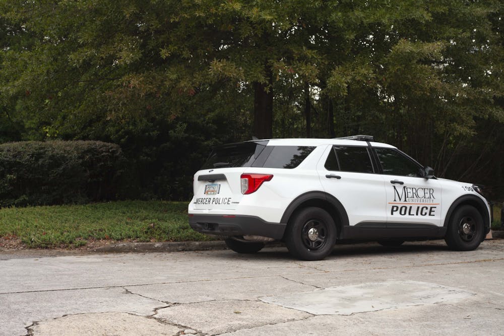 A Mercer Police Car parked outside of Mercer's Police building. 
