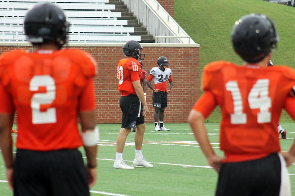 Kaelan Riley (2), Robert Riddle (10) and Tanner Brumby (14), left to right, find themselves in a competition for the starting quarterback job. One of them will replace graduated four-year starter John Russ.
