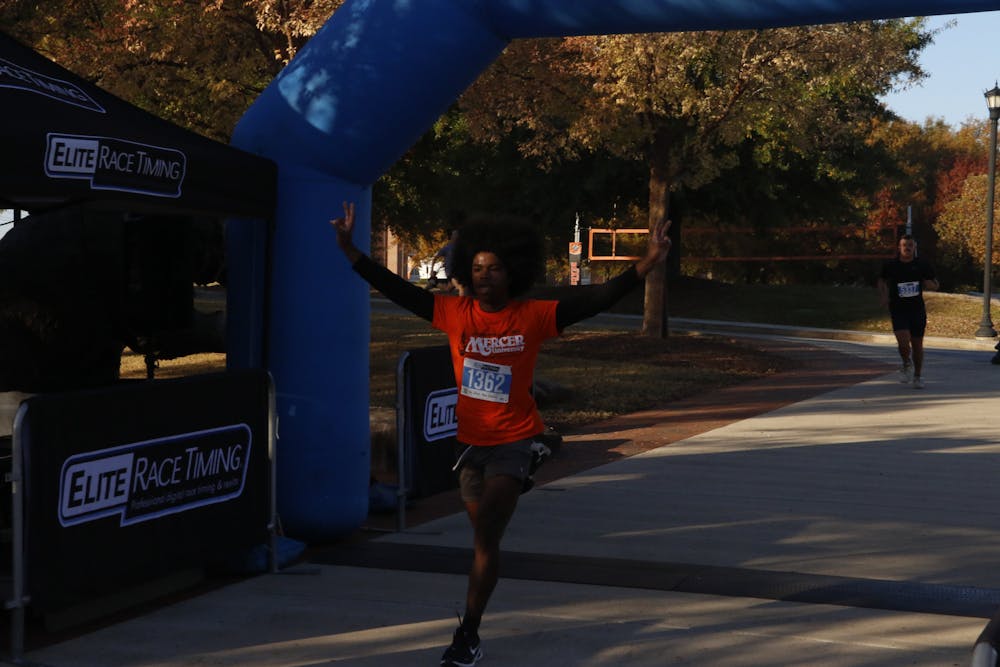 Bobby Shelton '27 crosses the line at Mercer's Homecoming 2025 5k on Saturday, Nov. 15, 2025 with a time of 19:29.