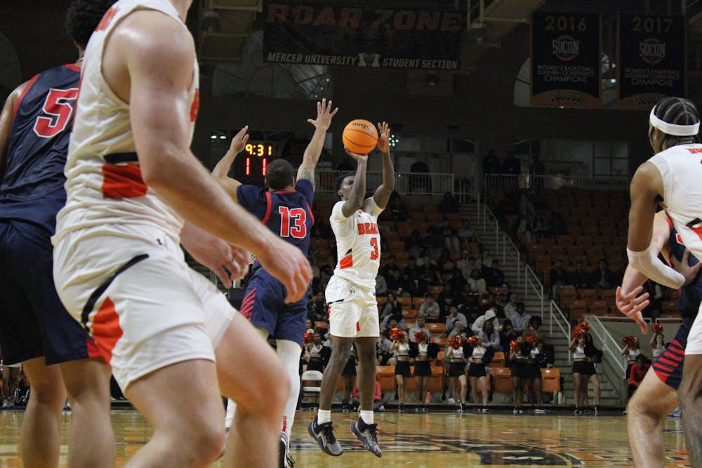 Tyler Johnson '25 puts up a shot against Samford University. Johnson leads the team in three-point percentage, knocking down 39.1 percent of his attempts from deep.