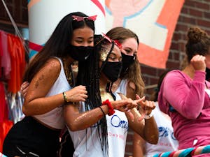 Members of Chi Omega pose for a photo in front of their house during Panhellenic Bid Day on Sept. 6, 2021.
