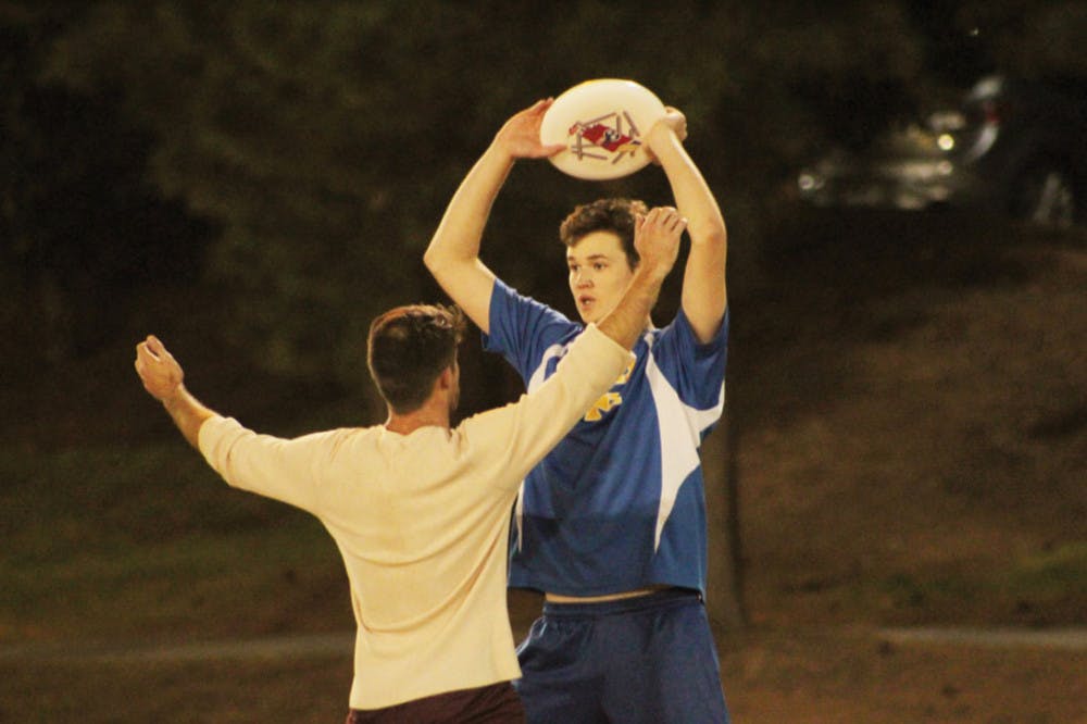 Tim Deremer prepares to pass the frisbee to another teammate.
