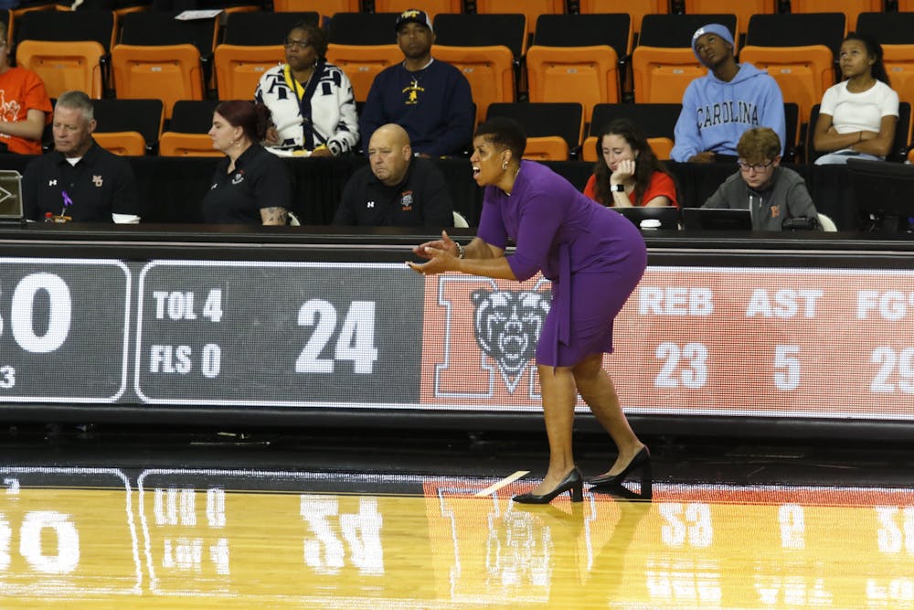 Michelle Clark-Heard urges her players along as they took on the North Carolina A&T Aggies on Nov. 17. The Bears won, 46-38,  giving Clark-Heard her second win as a Mercer coach.