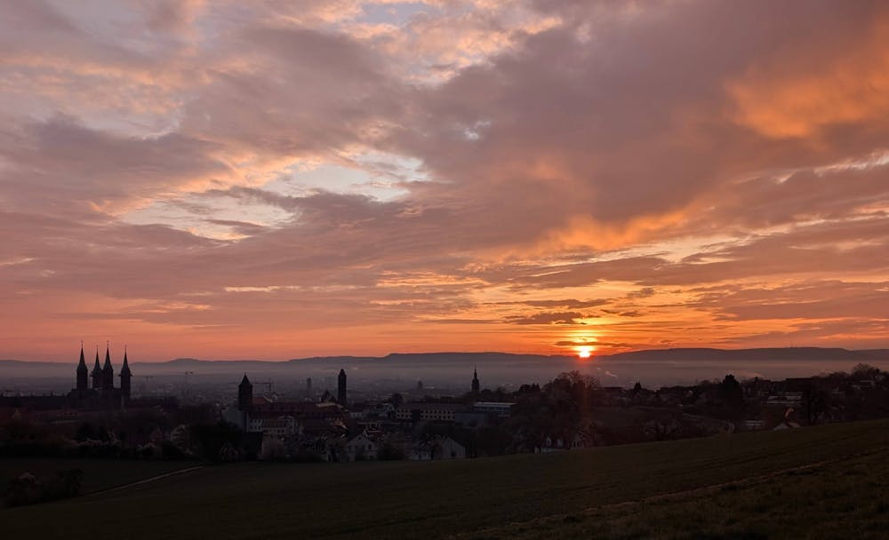 The sun rises over Bamberg, Germany on Monday, April 14, 2025.