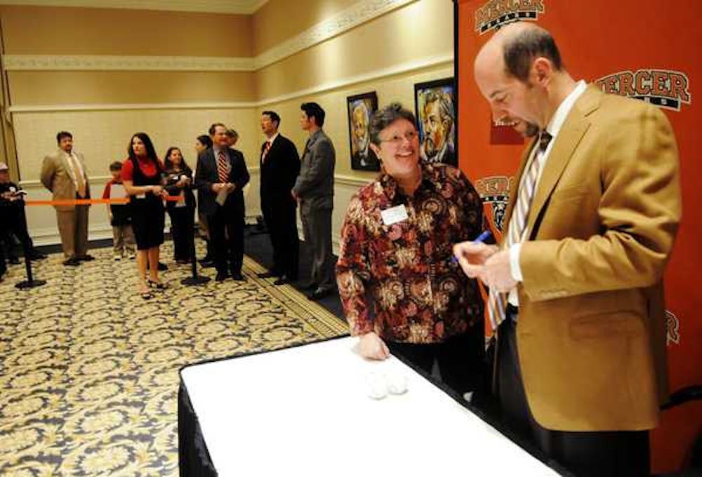 (Photo courtesy of Grant Blankenship - Macon.com) John Smoltz signs autographs following his speaking engagement at the First Pitch Classic.