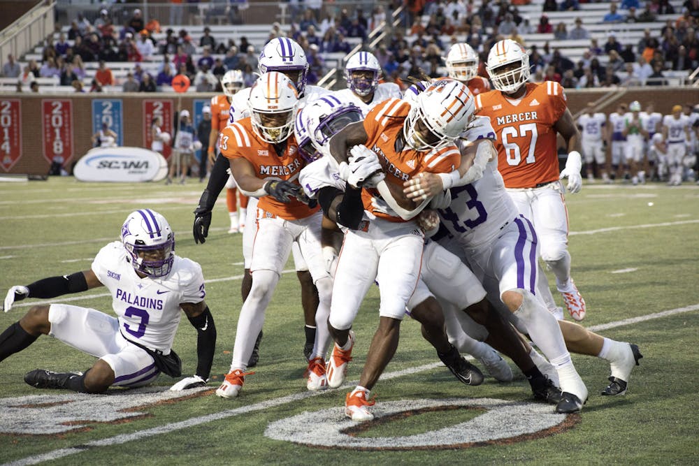 Devron Harper (#1) breaks through Furman players and avoids being taken down in the third quarter of the game. The Bears lost 23-13 to the Paladins. 