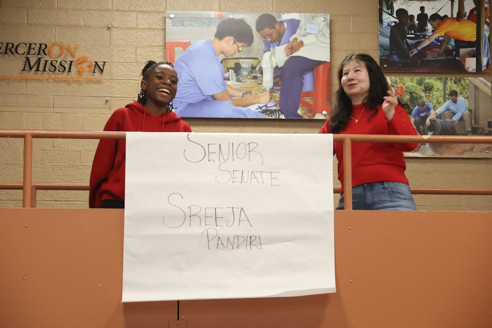 Student Government Association President Alisha Mitchell '26 (left) and Vice President Callie Lowery '26 (right) unveil the winner of the January 2026 senior senator race in the CSC on Jan. 16, 2026.