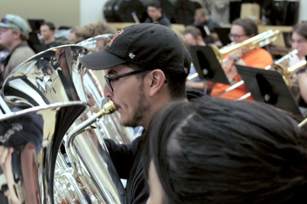 Euphonium player Robert Delgado '27 warms up before rehearsal on Nov. 12.