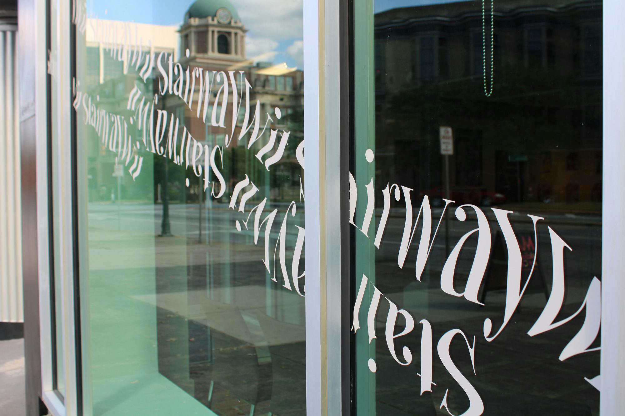 "Stairway Wit" opened Friday, April 22, 2022. The show was organized by the graduating class of 2022 art and design majors.