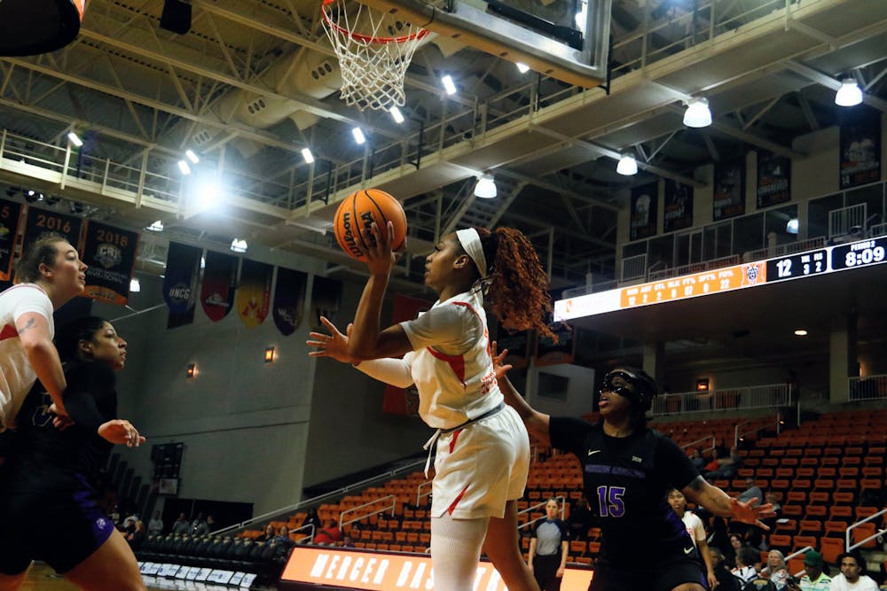 Ariana Bennett '26 dishes under the rim in a game against Western Carolina University on Feb. 28.