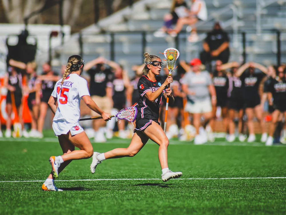 Caroline Glus '26 carries the ball against Clemson University on March 11, 2025. Glus recorded four goals in the Bears' upset of the No. 9 Tigers in Clemson, S.C.
