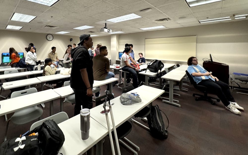 The Mercer Wii Club plays games on multiple screens in Stetson Hall. President Lucas Scott '27 on the far right. Photo courtesy of Charles Henry Fraley '27.