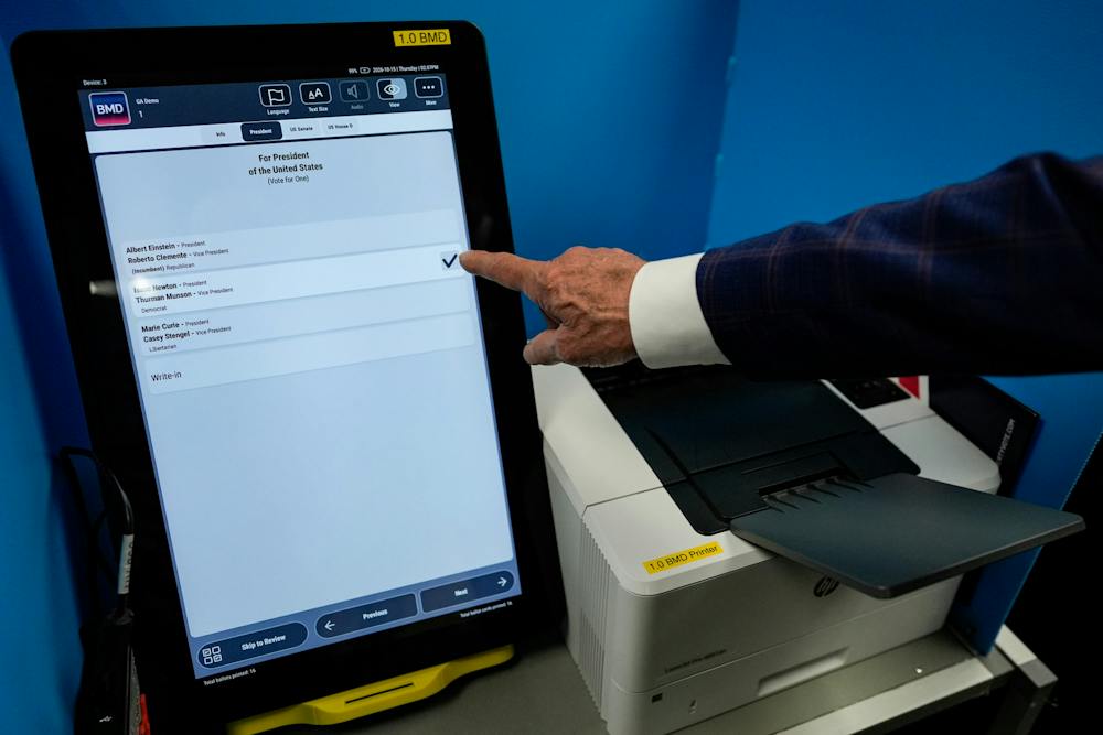 A voting machine is seen while vendors show their voting equipment to legislators for the 2028 election at the state capital, Thursday, Oct. 15, 2026, in Atlanta. (AP Photo/Mike Stewart)