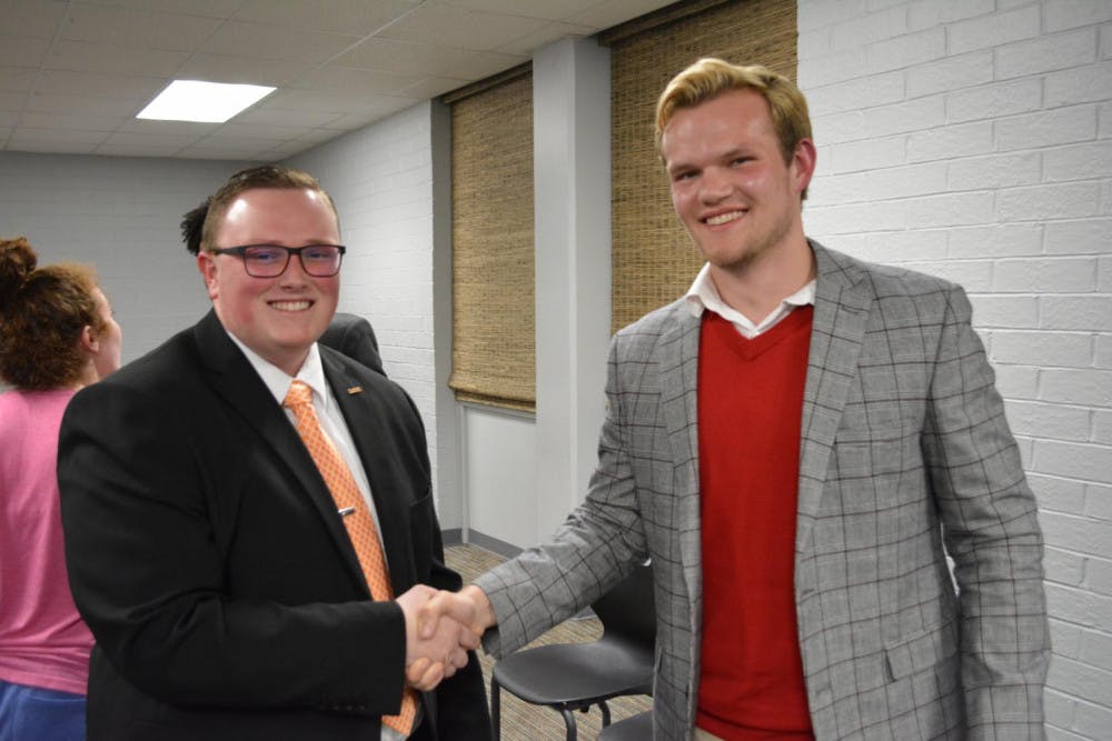 Adam Penland (left) and Brycen Higdon (right) shake hands after the SGA Q&A.