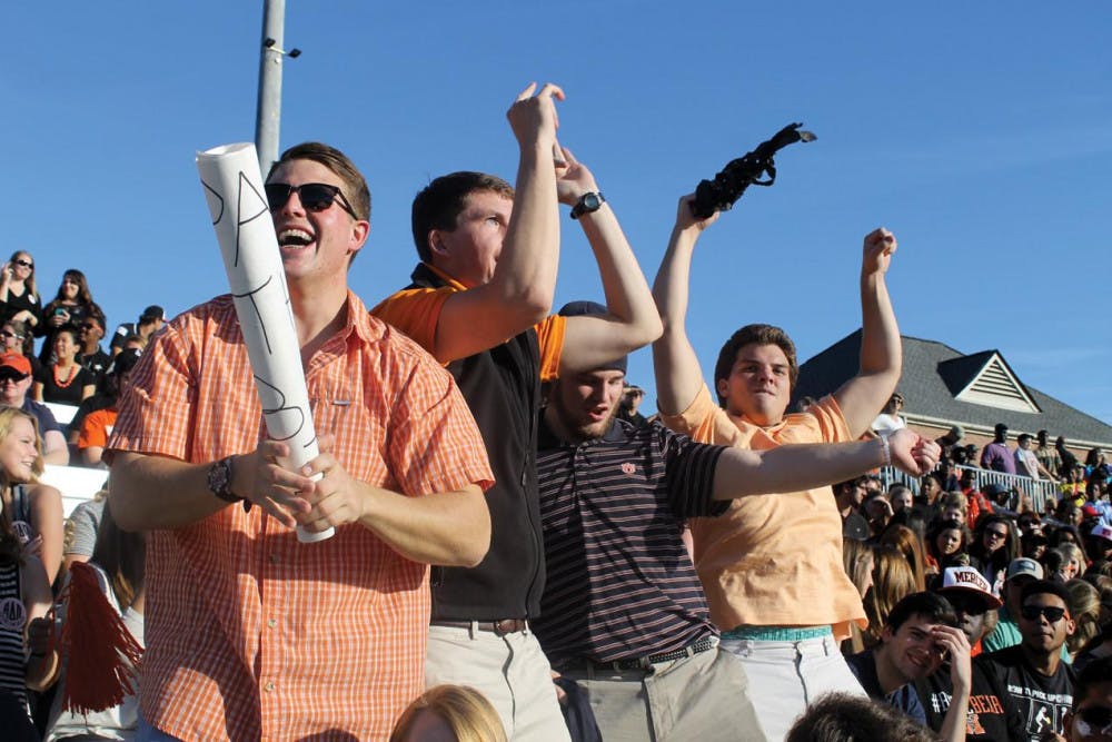 Students celebrate as Mercer scores a touchdown.