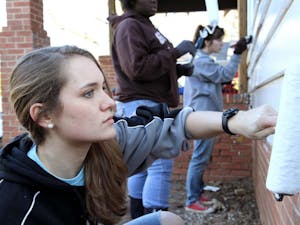 Janae-paints-a-house-as-part-of-the-2014-MLK-Day-of-Service