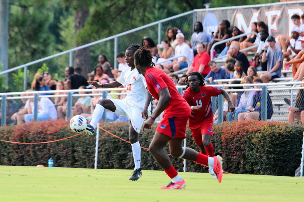 Will Taylor '29 pokes the ball towards a teammate in a home game against Florida Atlantic University on Aug. 20.