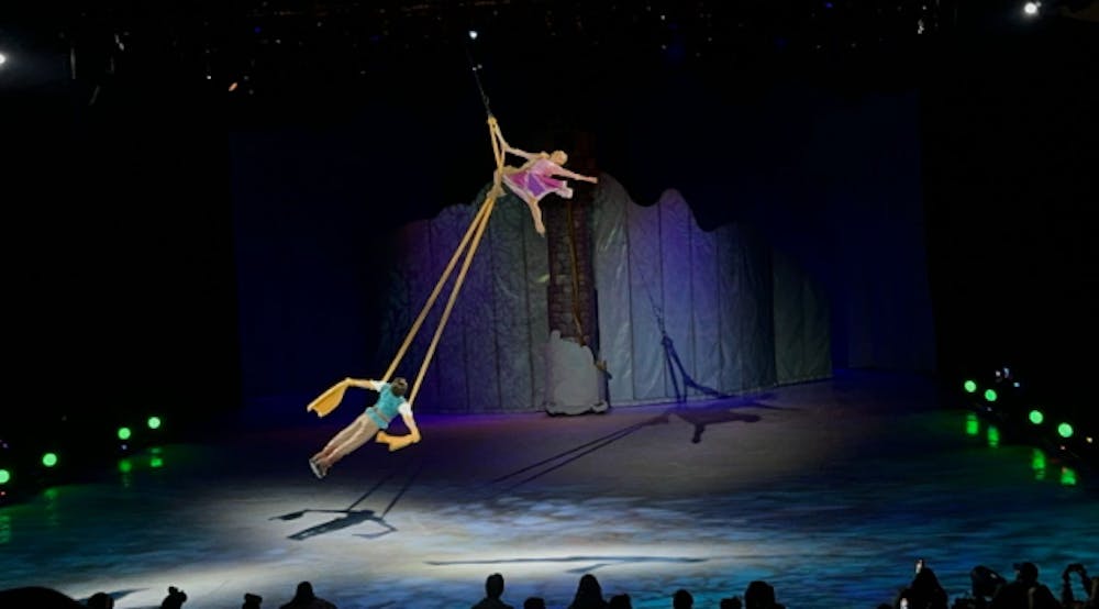 <p><em>Rapunzel and Flynn doing a stunt (Photo by Erica Remboske / Correspondent). </em></p>