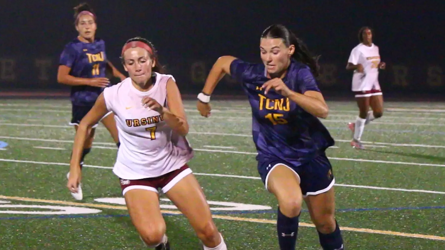 Midfielder Jenny Ward charges for the ball to Ursinus defender Lily Ballard. (Photo by Nick Kurti)