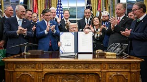 President Trump signs the funding bill to end the 43-day government shutdown in the Oval Office. (Photo courtesy of Wikimedia Commons)