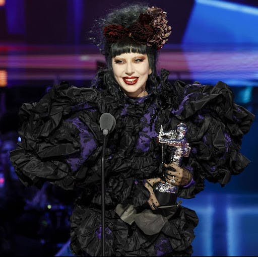 Lady Gaga on stage accepting the Artist of The Year award. (Photo courtesy of IMDb)