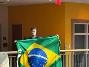 Enzo Manfredi encourages students to “Get involved” at TCNJ by joining “BRASA” in the spring semester. (Photo by Isabella McHugh)