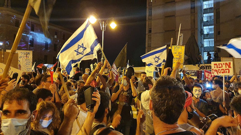 <p><em>Mass protests have been taking place across Israel in opposition to Prime Minister Benjamin Netanyahu’s judicial overhaul plans (Photo courtesy of Wikimedia Commons/“</em><a href="https://commons.wikimedia.org/wiki/File:Flags_at_Protests_against_Netanyahu_2020_Jerusalem.jpg" target=""><em>Flags at Protests against Netanyahu 2020 Jerusalem</em></a><em>” by Nir Hirshman Communications. August 1, 2020). </em></p>