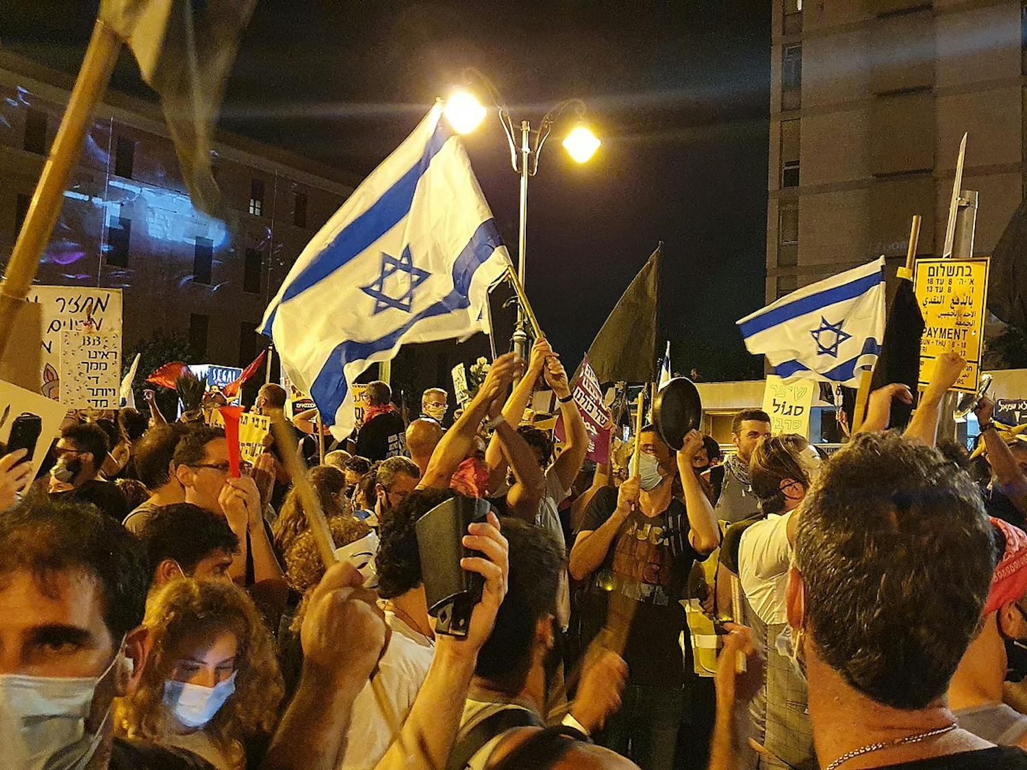 Mass protests have been taking place across Israel in opposition to Prime Minister Benjamin Netanyahu’s judicial overhaul plans (Photo courtesy of Wikimedia Commons/“Flags at Protests against Netanyahu 2020 Jerusalem” by Nir Hirshman Communications. August 1, 2020). 