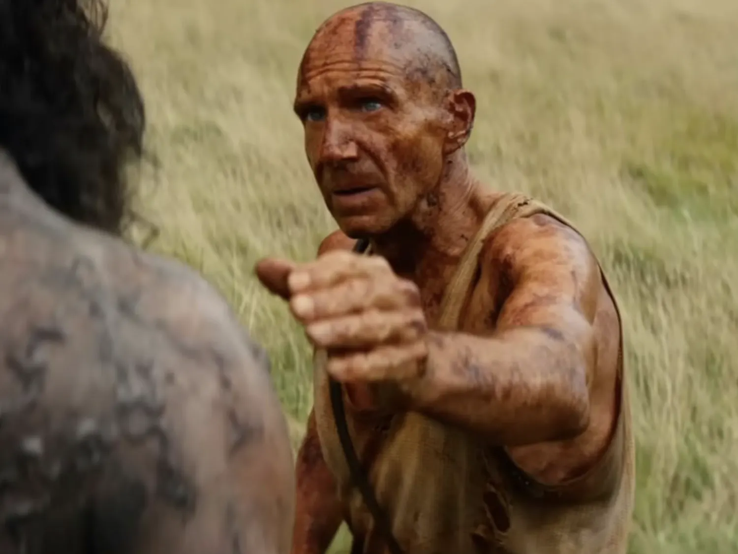 Ralph Fiennes (right) stars in the franchise’s fourth film as the eccentric humanitarian Dr. Ian Kelson with Chi Lewis-Parry (left) as the hulking infected ‘Samson.’ (Photo courtesy of IMDb)