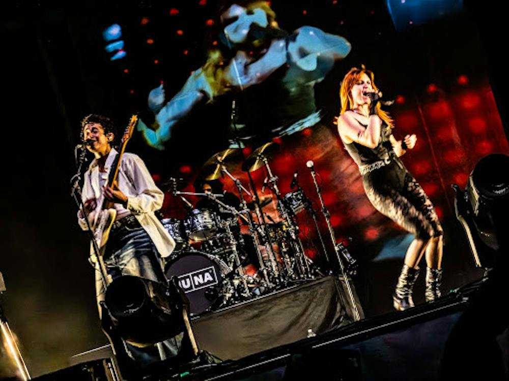 <p><em>MUNA member and producer Naomi McPherson (left) debuts on the “It Gets So Hot” tour in Philadelphia after being absent for a family emergency. (Photo by Andre Paras / Managing Editor)</em></p>