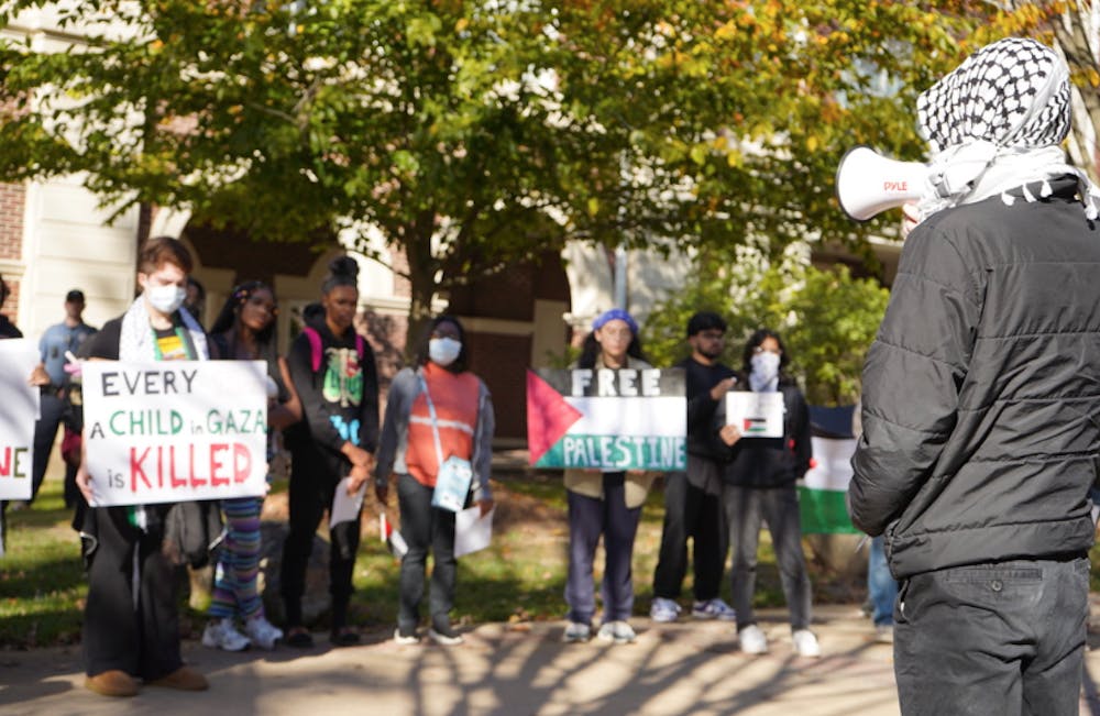 <p><em>In between marches, student speakers recited chants and spoke about the Israel-Palestine war (Photo courtesy of Aiman Shaikh).</em></p><p><em></em></p>