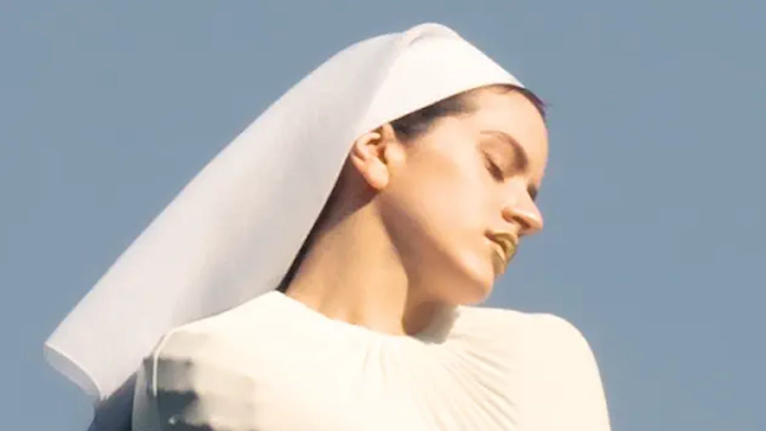 Rosalía poses on the album cover for “Lux.” (Photo courtesy of Apple Music)